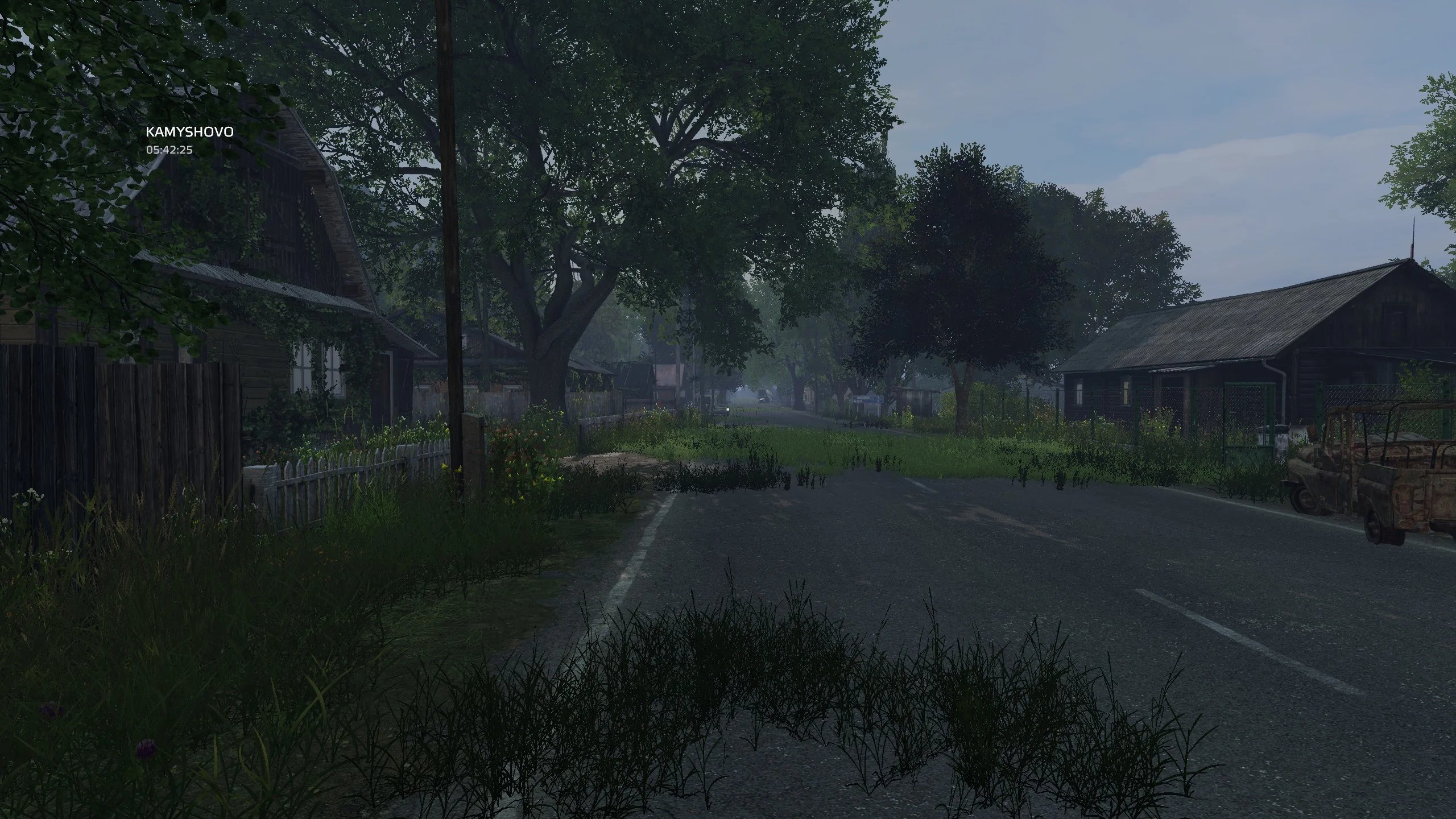A quiet, overgrown village street at dawn on the Salts Command DayZ server